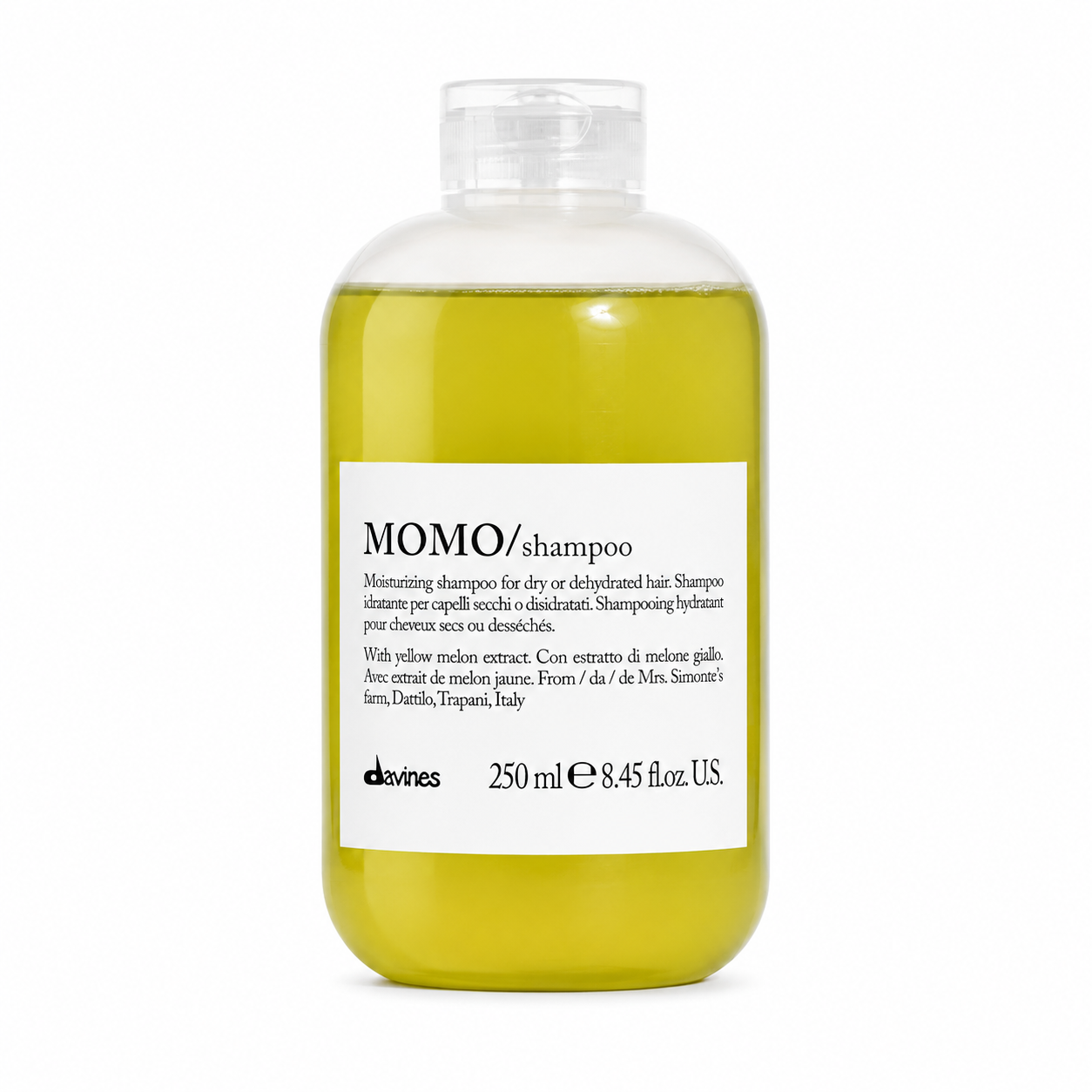 Bottle of Davines Momo shampoo on a white background
