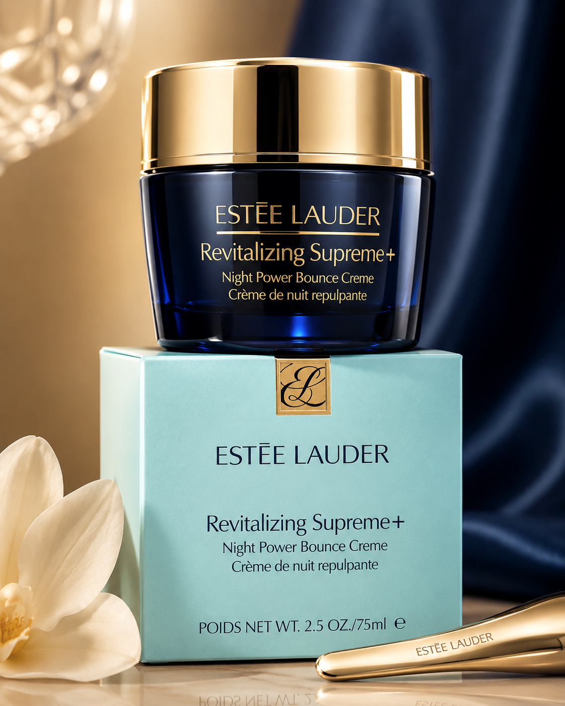 Estée Lauder Revitalizing Supreme+ Night Power Bounce Creme with packaging and flower on a blurred background