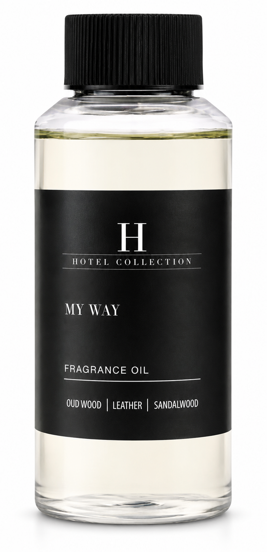 A bottle of Hotel Collection 'My Way' fragrance oil with a black cap and a black label, showing a pale yellow liquid inside, on a white background.