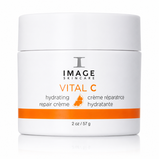 A white cosmetic jar of Image Skincare Vital C hydrating repair crème with orange and black text, set against a clean white background with a subtle reflection.